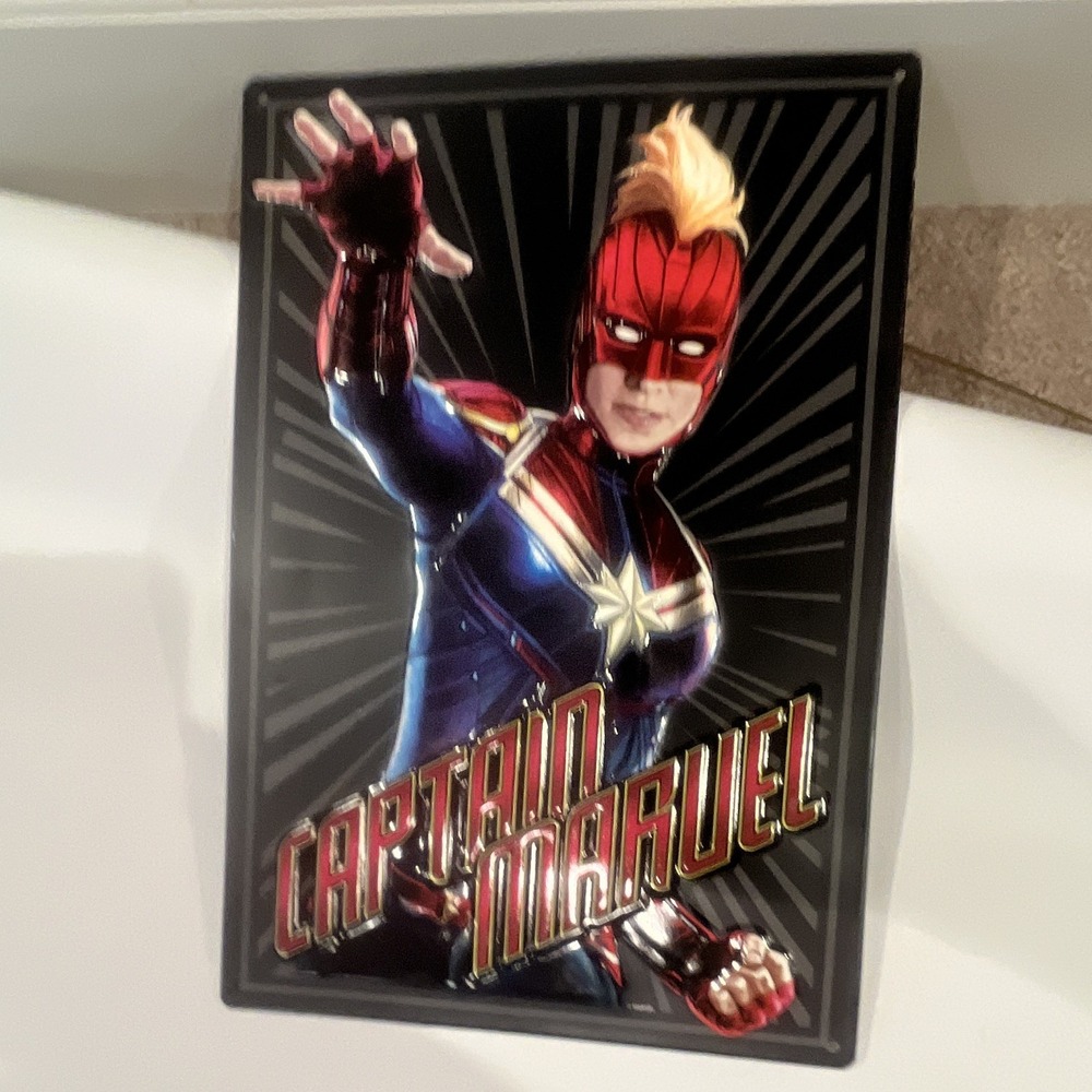 Open Road Brands Marvel Captain Marvel Embossed Metal Wall Sign Black 12x8